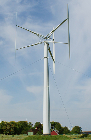 Vertical axis wind turbine against a blue sky. Photo.