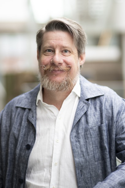 Portrait of a person with a mustache. Photograph. 