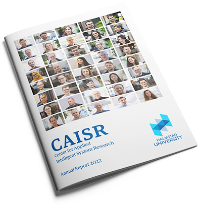 A print with several small portraits of people on the front and the text CAISR annual report 2022. Photo.