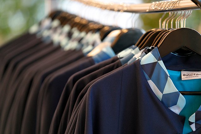 Capes hanging on a rack. Photo