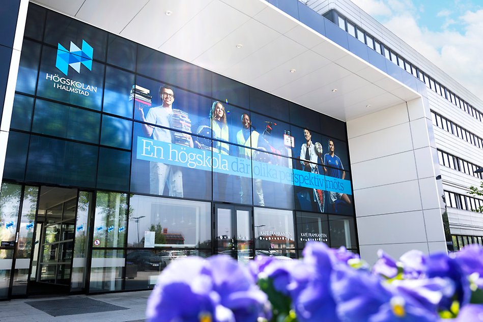 The University entrance. Flowers in the fore ground.