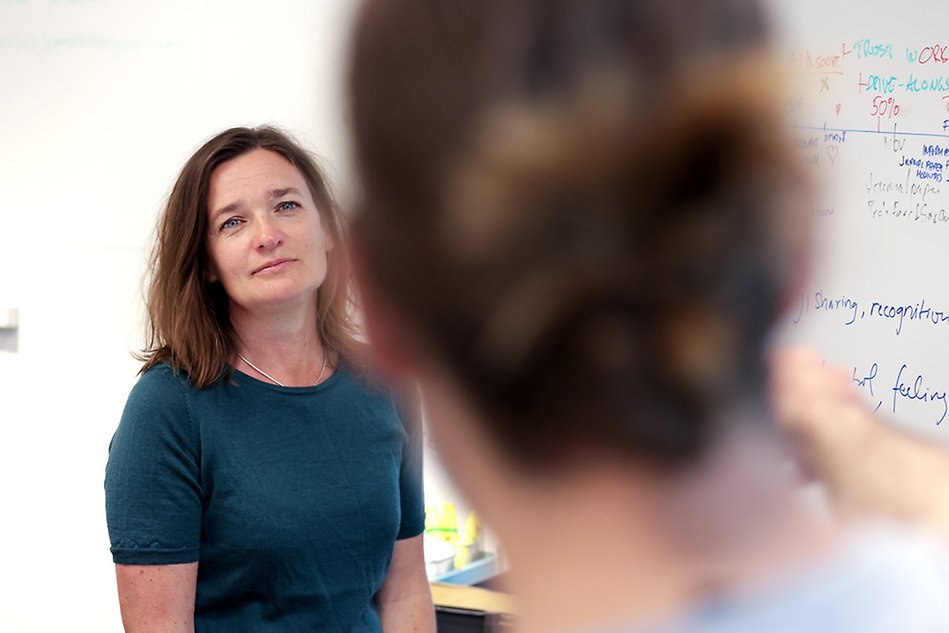 Woman listening to another person talking.