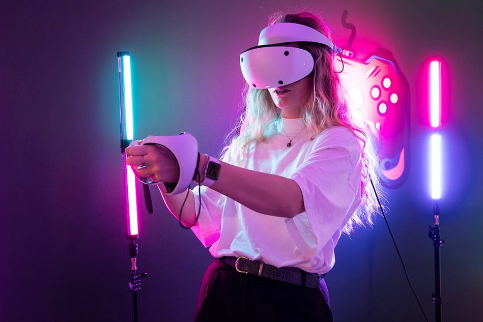 Female student playing around with VR glasses.. Photo.