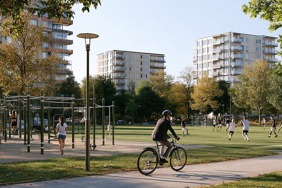 A residential area where two women are exercising at an outdoor gym, a man is cycling and young people are playing football.