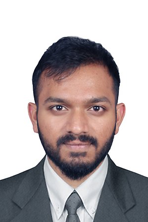 Portrait of a bearded man with dark hair wearing a suit. Photo.