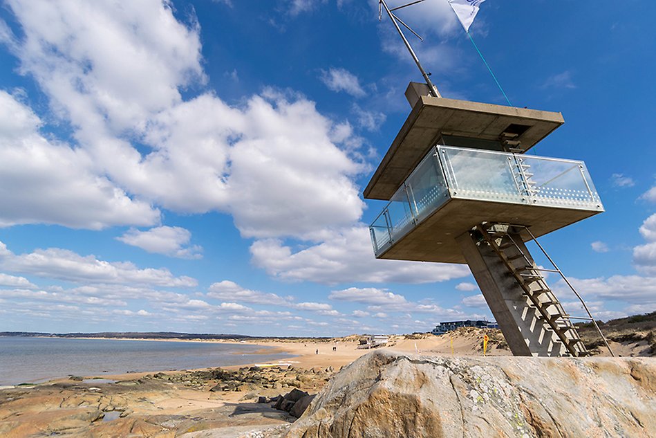 A lifeguard tower on a beach. Photo.