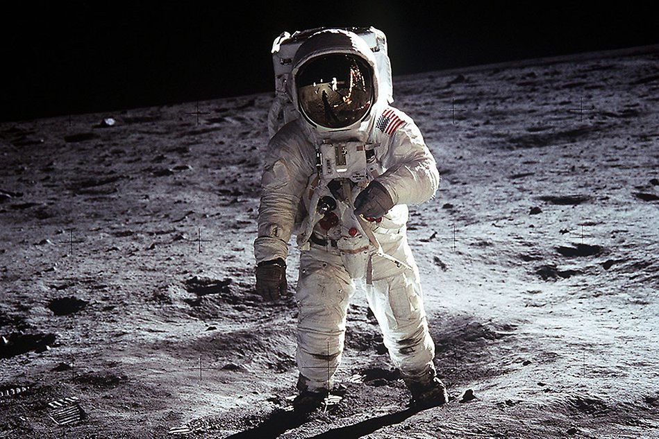 Astronaut standing on a grey surface, the moon
