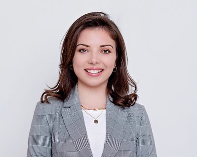 Smiling woman, dark hair, formally dressed