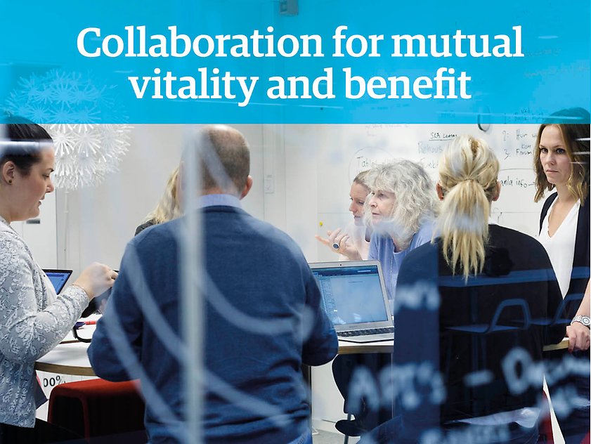 A group of people can be seen behind a glass wall in a meeting room talking to each other, the text "Collaboration for mutual vitality and benefit" is printed on top of the photograph.
